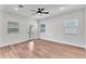 Minimalist living room boasts natural light, recessed lighting, and wood flooring at 1306 E Fillmore St, Phoenix, AZ 85006
