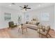 Well-lit living room featuring neutral tones, comfortable seating, and a decorative rug at 1306 E Fillmore St, Phoenix, AZ 85006