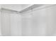 Neutral walk-in closet with clothing bars, storage space and built-in shelving at 1306 E Fillmore St, Phoenix, AZ 85006