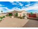 Expansive backyard with brick patio, outdoor kitchen, and manicured landscaping at 13204 W Palo Verde Dr, Litchfield Park, AZ 85340