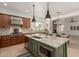 Open kitchen with a large island, stone countertops, stainless steel appliances, and breakfast bar at 13204 W Palo Verde Dr, Litchfield Park, AZ 85340