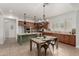 Bright kitchen with a large island, stone countertops, stainless steel appliances, and custom cabinets at 13204 W Palo Verde Dr, Litchfield Park, AZ 85340