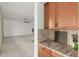 Bright kitchen features granite countertops, and wood cabinets at 13204 W Palo Verde Dr, Litchfield Park, AZ 85340