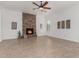 Bright living room featuring stone fireplace, perfect for cozy gatherings and relaxation at 13204 W Palo Verde Dr, Litchfield Park, AZ 85340