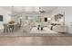 Open-concept living space featuring neutral tones, large windows, and modern furnishings at 13204 W Palo Verde Dr, Litchfield Park, AZ 85340