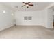 Bright living room features a ceiling fan, neutral carpet, and an open floor plan at 13204 W Palo Verde Dr, Litchfield Park, AZ 85340