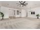 Spacious living room with neutral carpet, creating a blank canvas for personalization and comfort at 13204 W Palo Verde Dr, Litchfield Park, AZ 85340