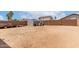 Large backyard with shed and fence, providing a canvas for landscaping and outdoor activities at 136 W Brahman Blvd, San Tan Valley, AZ 85143