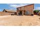 Vast backyard featuring a covered patio, offering ample space for outdoor living and recreation at 136 W Brahman Blvd, San Tan Valley, AZ 85143