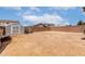 Large backyard with fence and shed, offering space for outdoor activities and storage at 136 W Brahman Blvd, San Tan Valley, AZ 85143