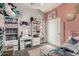 Inviting bedroom featuring a cozy bed, shelves, and soft natural light at 136 W Brahman Blvd, San Tan Valley, AZ 85143