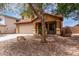 Inviting two-story home with a neutral palette, desert landscaping, covered porch, and a two-car garage at 136 W Brahman Blvd, San Tan Valley, AZ 85143