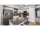 Stylish kitchen featuring stainless steel appliances, granite countertops and white cabinetry at 136 W Brahman Blvd, San Tan Valley, AZ 85143