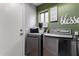 Well-lit laundry room showcasing a modern washer and dryer set for convenient chores at 136 W Brahman Blvd, San Tan Valley, AZ 85143