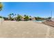 Expansive backyard with a pool, mature trees, and ample space for outdoor activities at 13650 N 70Th Dr, Peoria, AZ 85381