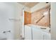 Bright bathroom featuring a walk-in tub with safety grab bars and a shower curtain at 13650 N 70Th Dr, Peoria, AZ 85381