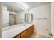 Standard bathroom featuring single sink vanity with mirror and enclosed shower at 13650 N 70Th Dr, Peoria, AZ 85381