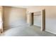 Bedroom featuring carpeted floors, closet, and neutral paint throughout at 13650 N 70Th Dr, Peoria, AZ 85381