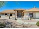 Front entrance with walkway, desert landscaping, and unique architectural details at 13650 N 70Th Dr, Peoria, AZ 85381