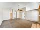 Open living area with archways, ceiling fan and views to other rooms in the home at 13650 N 70Th Dr, Peoria, AZ 85381