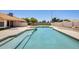 Backyard pool featuring a diving board and surrounding patio area at 13650 N 70Th Dr, Peoria, AZ 85381