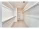 Walk-in closet offers ample storage space with shelving and hanging racks at 13650 N 70Th Dr, Peoria, AZ 85381