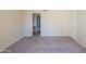 Bedroom with neutral walls and carpet and doorway to bathroom visible in background at 1506 N Oak St, Tempe, AZ 85288