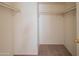 A well-lit closet with carpet flooring and ample shelving for storage in this home at 1506 N Oak St, Tempe, AZ 85288