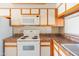 Functional kitchen featuring white appliances, and ample counter space at 1506 N Oak St, Tempe, AZ 85288