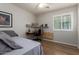 Bedroom with a desk, ceiling fan, and window allowing natural light at 16031 W Williams St, Goodyear, AZ 85338