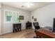 Bedroom featuring a ceiling fan, natural light, and built in shelving at 16031 W Williams St, Goodyear, AZ 85338