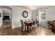 Elegant dining area with a chandelier, stylish chairs, and a view of the backyard at 16031 W Williams St, Goodyear, AZ 85338