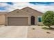 Charming single-story home with a two-car garage and desert landscaping in a sunny neighborhood at 16031 W Williams St, Goodyear, AZ 85338