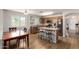 Well-equipped kitchen featuring stainless steel appliances, an island with bar seating, and wooden cabinets at 16031 W Williams St, Goodyear, AZ 85338