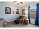 Bedroom featuring a gray couch, a small table, blue curtains and Star Wars decor at 16226 S 35Th Dr, Phoenix, AZ 85045