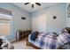 Cozy bedroom with a window, sliding closet doors and an entertainment theme at 16226 S 35Th Dr, Phoenix, AZ 85045