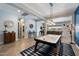 Open-concept living area features a game table, stylish lighting, and seamless flow to other spaces at 16226 S 35Th Dr, Phoenix, AZ 85045