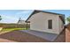 Exterior of home with a concrete patio, stone landscaping, and artificial grass at 18205 N 18Th St, Phoenix, AZ 85022