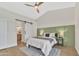 Bright bedroom features a sliding barn door to the bath and neutral color palette, creating a serene retreat at 18205 N 18Th St, Phoenix, AZ 85022