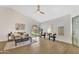 Bright living room with vaulted ceiling, modern ceiling fan, and luxury vinyl flooring at 18205 N 18Th St, Phoenix, AZ 85022