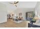 Open-concept living room featuring a ceiling fan, and luxury vinyl flooring at 18205 N 18Th St, Phoenix, AZ 85022