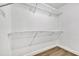Spacious walk-in closet with ample shelving, providing organized storage solutions for clothing and accessories at 18205 N 18Th St, Phoenix, AZ 85022