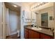 Well-lit bathroom with a vanity, sink, and shower, providing a clean and functional space at 1941 S Pierpont Dr # 2073, Mesa, AZ 85206