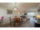 Open concept dining and living area with lots of natural light and view to the exterior at 1941 S Pierpont Dr # 2073, Mesa, AZ 85206