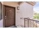 Exterior view of the front door with a 'no smoking' sign, unit number, and railings at 1941 S Pierpont Dr # 2073, Mesa, AZ 85206