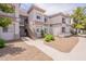 Exterior of condo building with multiple levels, stairwell and desert landscaping at 1941 S Pierpont Dr # 2073, Mesa, AZ 85206
