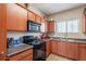 Neutral kitchen with wood cabinets, appliances, and decor at 1941 S Pierpont Dr # 2073, Mesa, AZ 85206