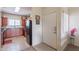 Bright kitchen features ample cabinetry and appliances with a view of the front entrance at 1941 S Pierpont Dr # 2073, Mesa, AZ 85206