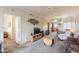 Spacious living room with entertainment center, dining and kitchen area in an open layout at 1941 S Pierpont Dr # 2073, Mesa, AZ 85206