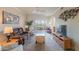 Cozy living room with plush seating, neutral tones and sliding glass doors to balcony at 1941 S Pierpont Dr # 2073, Mesa, AZ 85206